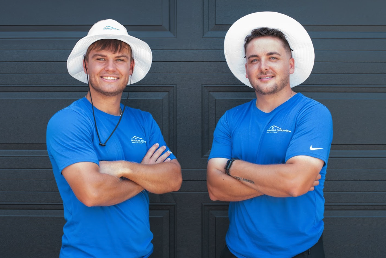 ClearView co-owners in front of garage